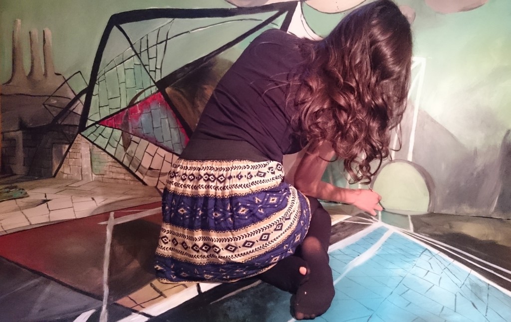 Jamaika Lukac working on her mural in progress